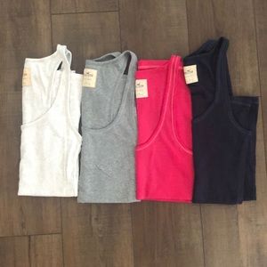 Lot: 4 large Hollister ribbed racer back tank tops